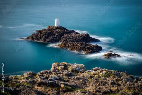 beacon on an offshore rock at Pointe de la Varde, Bretagne, France photo