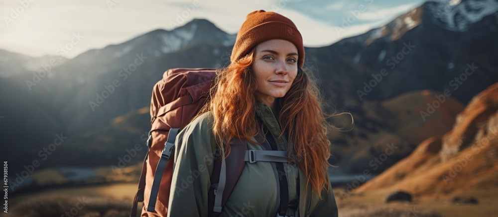 Portrait young woman wearing a backpack in mountain at sunny day. AI generated image