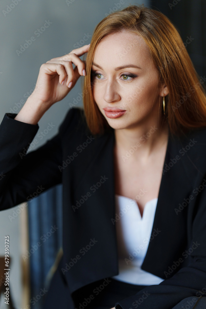 Beautiful businesswoman in black business suit. Beautiful businesswoman in black business suit.