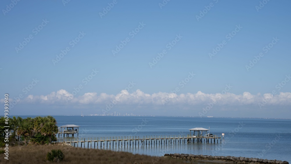 Scenic view of a pier on a tranquil lake on a sunny day