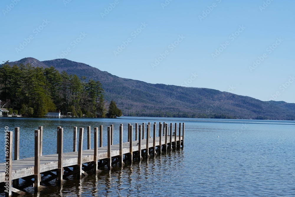 Scenic view of a pier on a tranquil lake on a sunny day