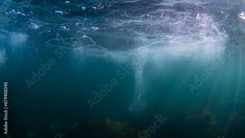 Bubble and light beam under the water surface. © AlexandraDaryl