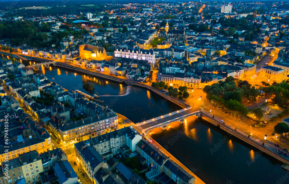Laval city and Mayenne river in the evening. View from above. France