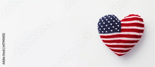 heart shape knitted with USA flag on white background with Copy space.