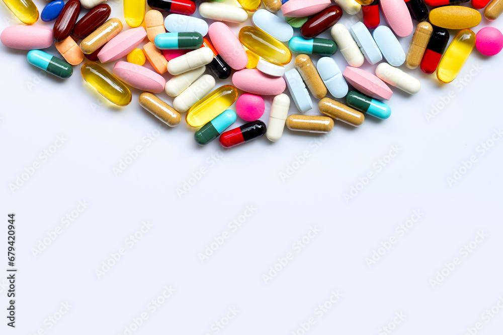Colorful tablets with capsules and pills on white. Colorful tablets with capsules and pills on white.
