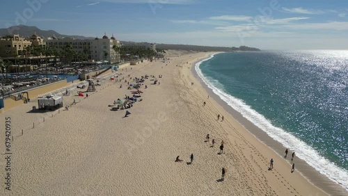 People enjoying the beach and surf in Cabo Mexico
