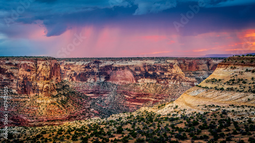 Bad weather over The Little Grand Canyon and the San Rafael Swell at sunset viewed from The Wedge Viewpoint in Utah, USA
