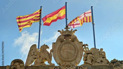 Close view of the Casa de la Ciutat with flags of Barcelona, Spain and Catalonia on top of it in Spain photo