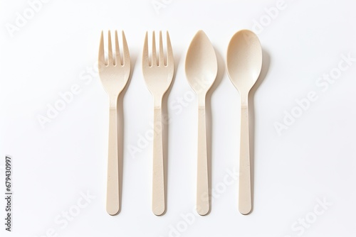 Biodegradable cutlery isolated on white.