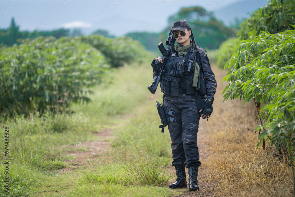 Female Thai soldier surveying during field training