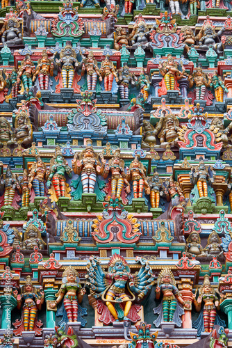 Sculptures on Hindu temple gopura (tower). Menakshi Temple, Madurai, Tamil Nadu, India photo
