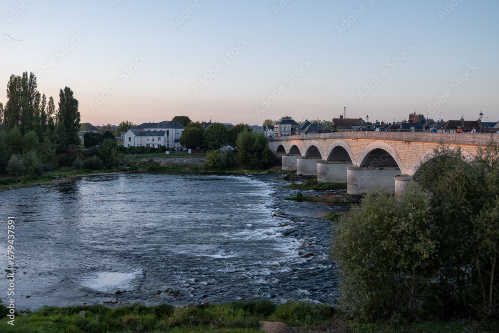 Walking in Amboise medieval town with royal castle located on Loire river and view on old bridge, France