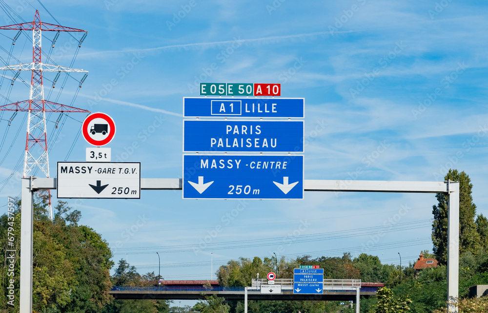 Naklejka premium Highway road signs Paris, driving in heavy traffic on ring road of capital of France, traffic jam problems in Paris