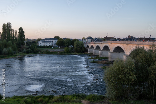 Walking in Amboise medieval town with royal castle located on Loire river and view on old bridge, France