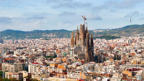 Aerial drone view of Sagrada Familia in city downtown. Famous residential districts around, greenery, Barcelona, Spain photo
