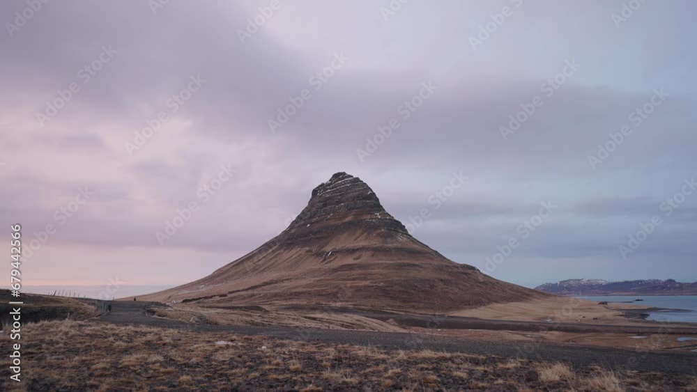 Admirable Kirkjufell mountain scenery during overcast day in Iceland Admirable Kirkjufell mountain scenery during overcast day in Iceland