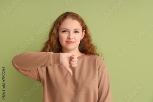 Young woman showing dislike...