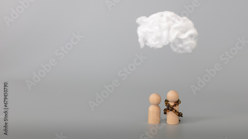 Psychology, solitude, fear, dependence or mental health problem concept. Sick couple concept. Depressed sad person with a cloud overhead hiding in a bag, on grey background. Copy space.