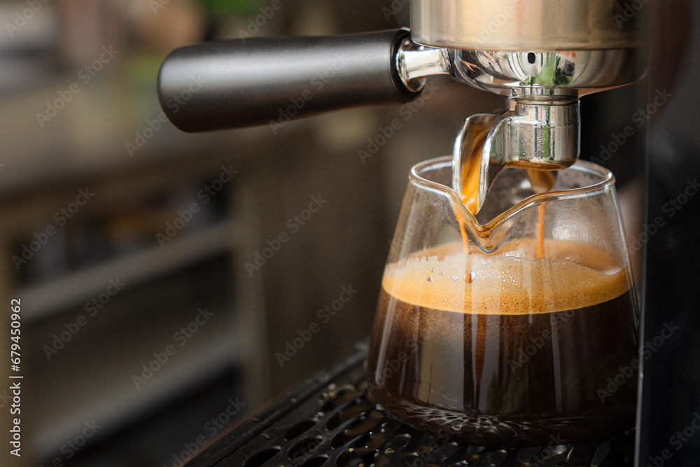 making a big shot of espresso at the coffee shop. a cup of espresso coffee making a big shot of espresso at the coffee shop. a cup of espresso coffee