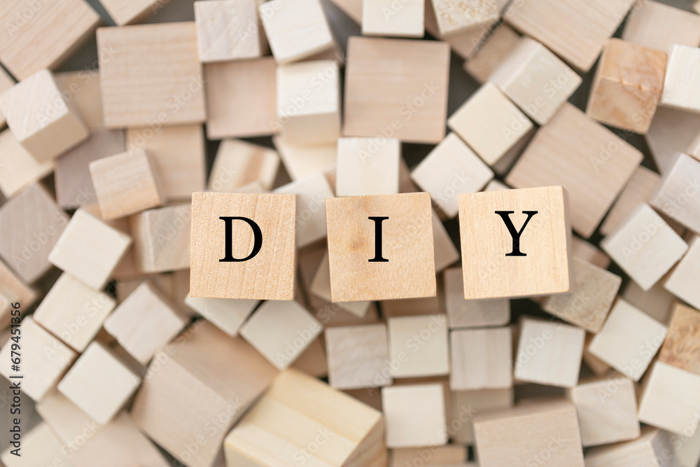 DIY (do it yourself) concept. Abstract geometric wooden dice. DIY icon. DIY (do it yourself) concept. Abstract geometric wooden dice. DIY icon.