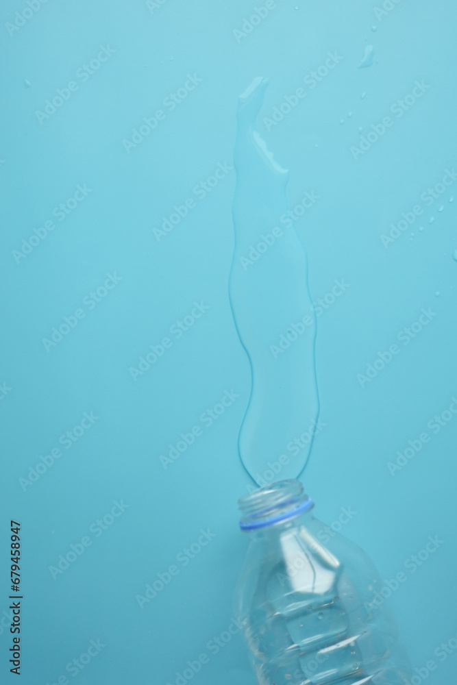 top view of a bottle of water spilled on a table , top view of a bottle of water spilled on a table ,