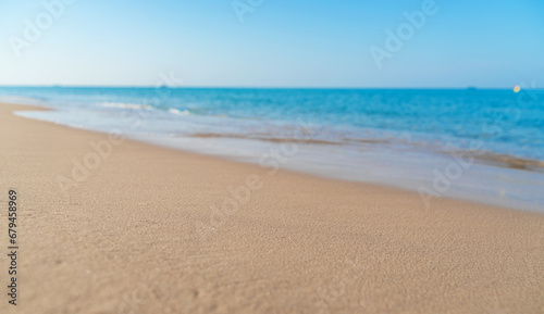 Tropical sea beach with sand and wave of the sea