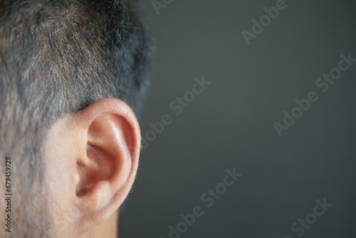 closeup of human ear on black background  photo
