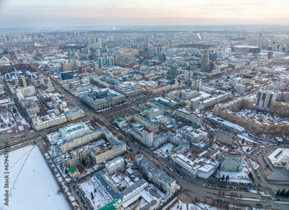 Embankment of the central pond and Plotinka in Yekaterinburg at winter sunset. The historic center of the city of Yekaterinburg, Russia, Aerial View
