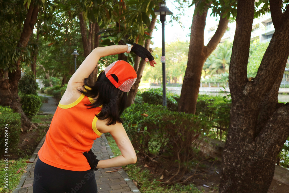 Active Woman Stretching in the Garden