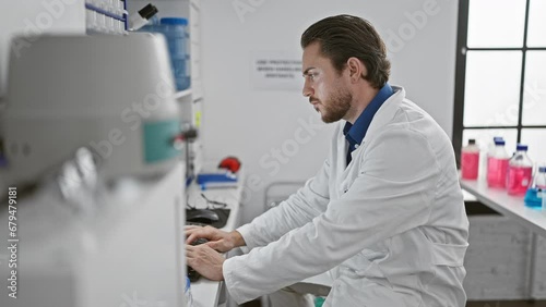 Wallpaper Mural Young hispanic man scientist using computer smiling at laboratory Torontodigital.ca