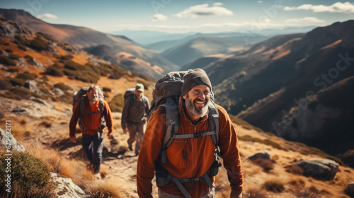 Group of male travelers with backpacks exploring on mountain.