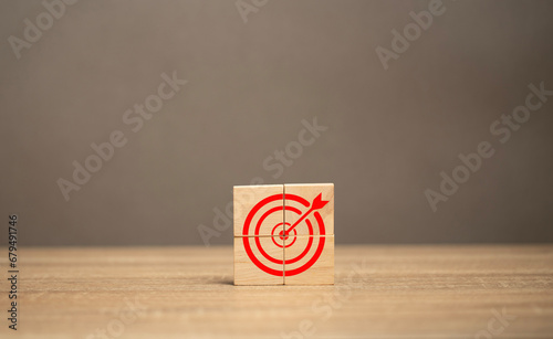 Icon marketing or business target goal with red arrow on the table. Concept of business growth success. The planning and strategy in company development. © teerasub