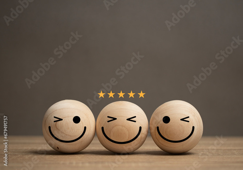 concept of service satisfaction A smiley face ball is placed on the table and there is a gold star on the ball. The customer feedback survey rating. Business excellent score. Good evaluation emotion.