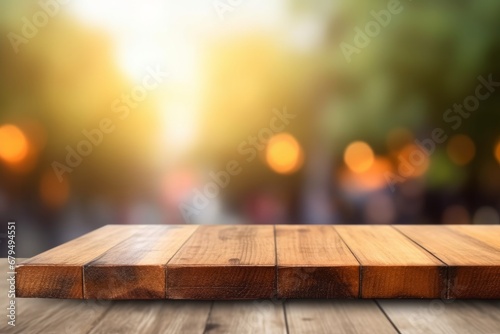 Wooden table top on blur background with bokeh image.