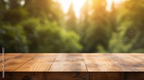 Wooden table top on blurred green nature background - can be used for display or montage your products