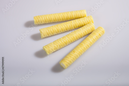 Yellow filled tubes isolated on white background