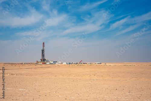 Onshore Oil Drilling Rig, in desert area. Industrial Marvel in Offshore Energy Exploration and Petroleum Production. Oil drilling and work over rig in desert isolated.