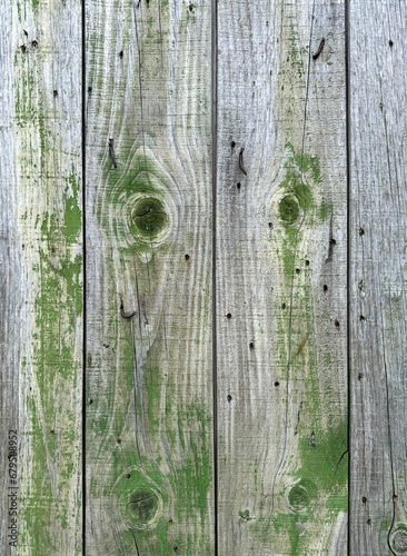 Old boards on a wooden fence as an abstract background