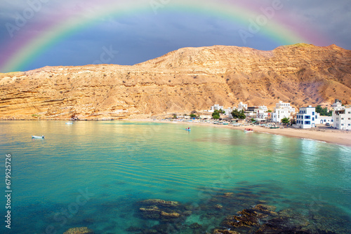 Rainbow over picturesque village of Quantab on coast of the Gulf of Oman photo