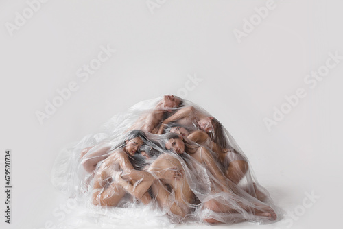 people under transparent plastic on white background