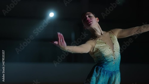 Talented Young Woman Dancing On Ice Rink, Beautiful Female Figure Skater, Medium Portrait photo