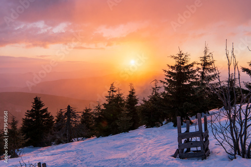 Colorful winter sunrise in mountains.Lysa mount in Beskydy mountain in Czech republic