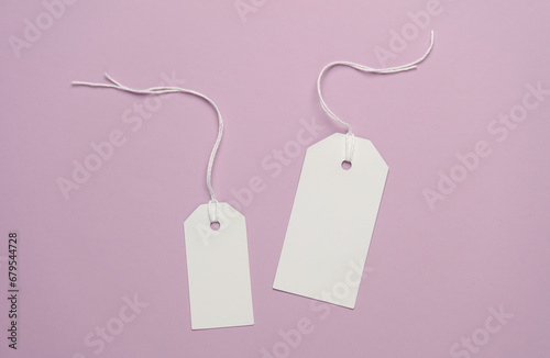 Two blank white price tag mockup on magenta background
