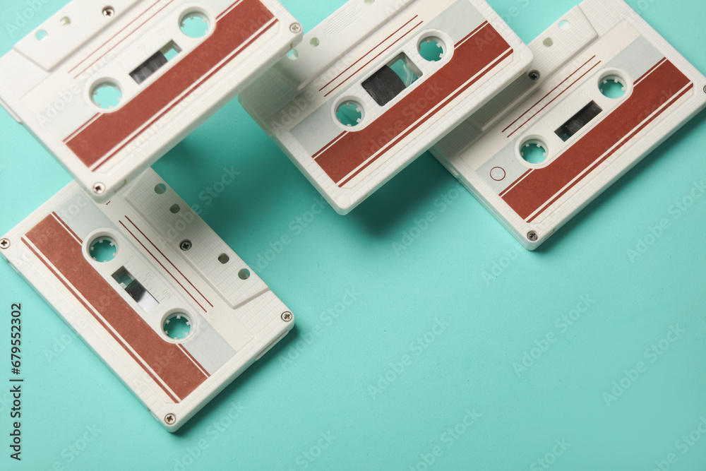 Floating retro 80s audio cassettes on a blue background. Conceptual pop, creative layout. Minimalism Floating retro 80s audio cassettes on a blue background. Conceptual pop, creative layout. Minimalism