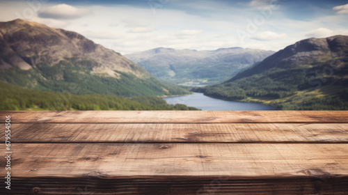 Empty rustic old wooden boards table against majestic landscape with mountains