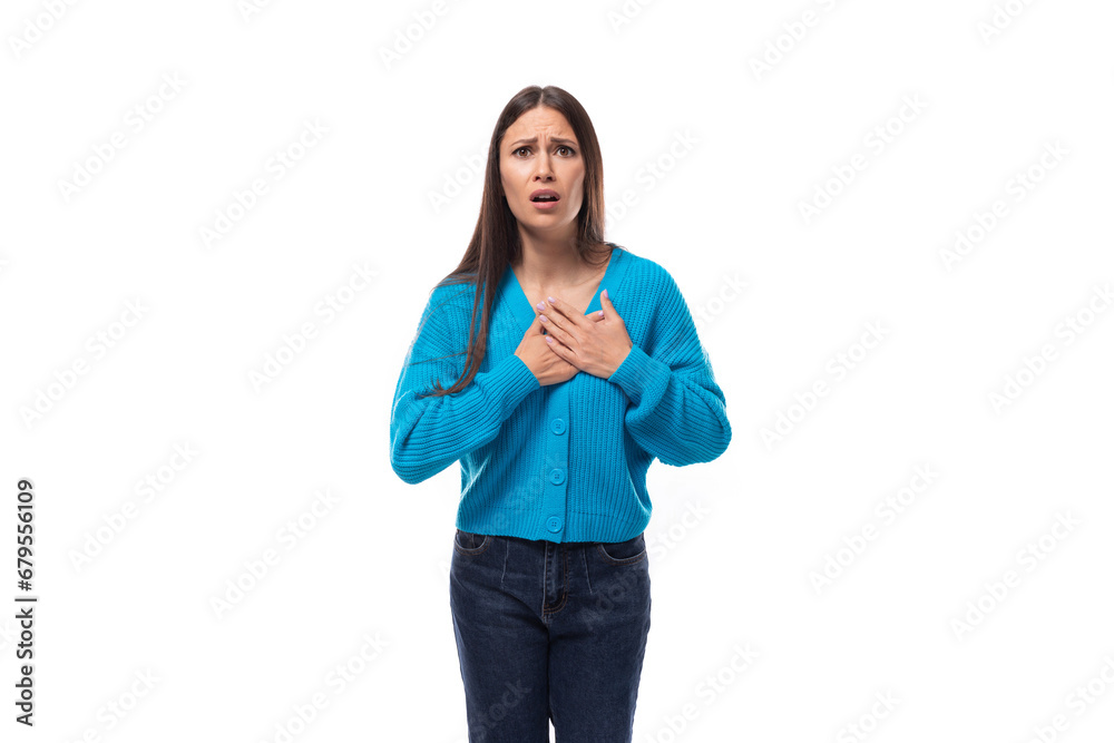 surprised young brunette lady dressed in blue casual button up cardigan on white background surprised young brunette lady dressed in blue casual button up cardigan on white background