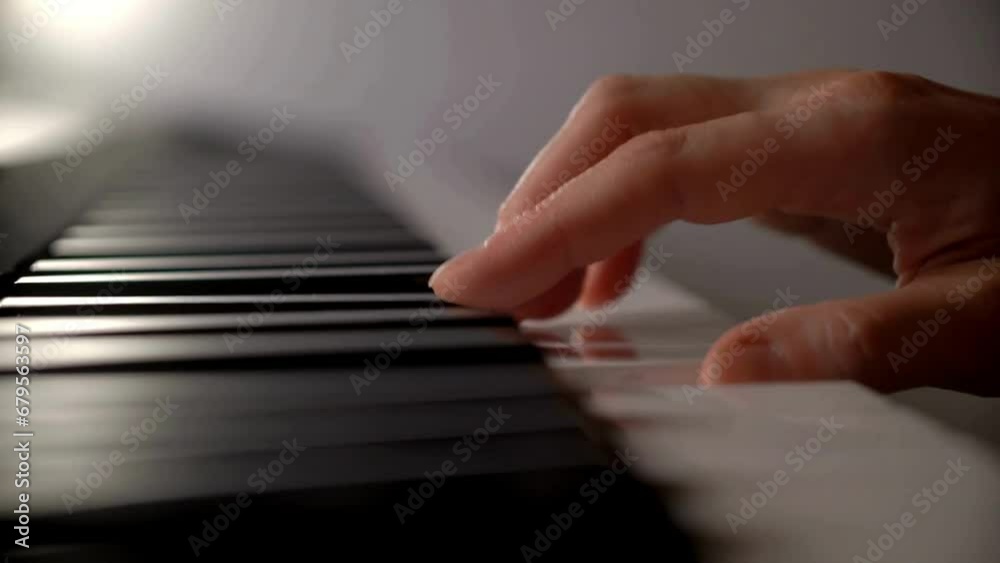 female hands playing the piano. Professional piano playing close-up. Musician