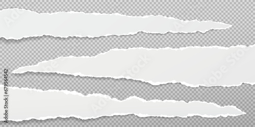 Torn, ripped white paper strips with soft shadow are on squared background for text. photo