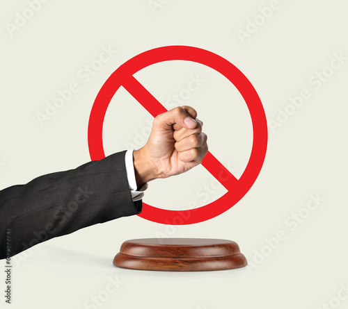 Law solves the problem. Human rights. The man hits his hand on the gavel of justice. The boycotting man clenched his fist. Rule of law. Constitutional state. (ID: 679572743)