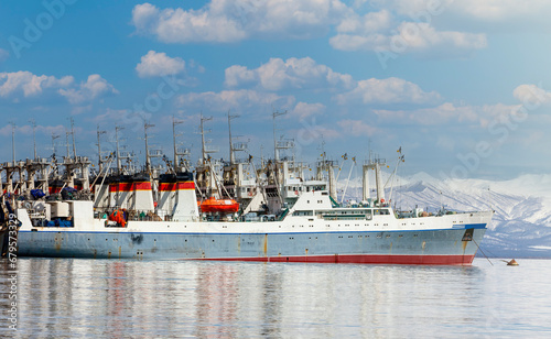 Fishing seiners near the pier in Avacha Bay in Kamchatka. photo